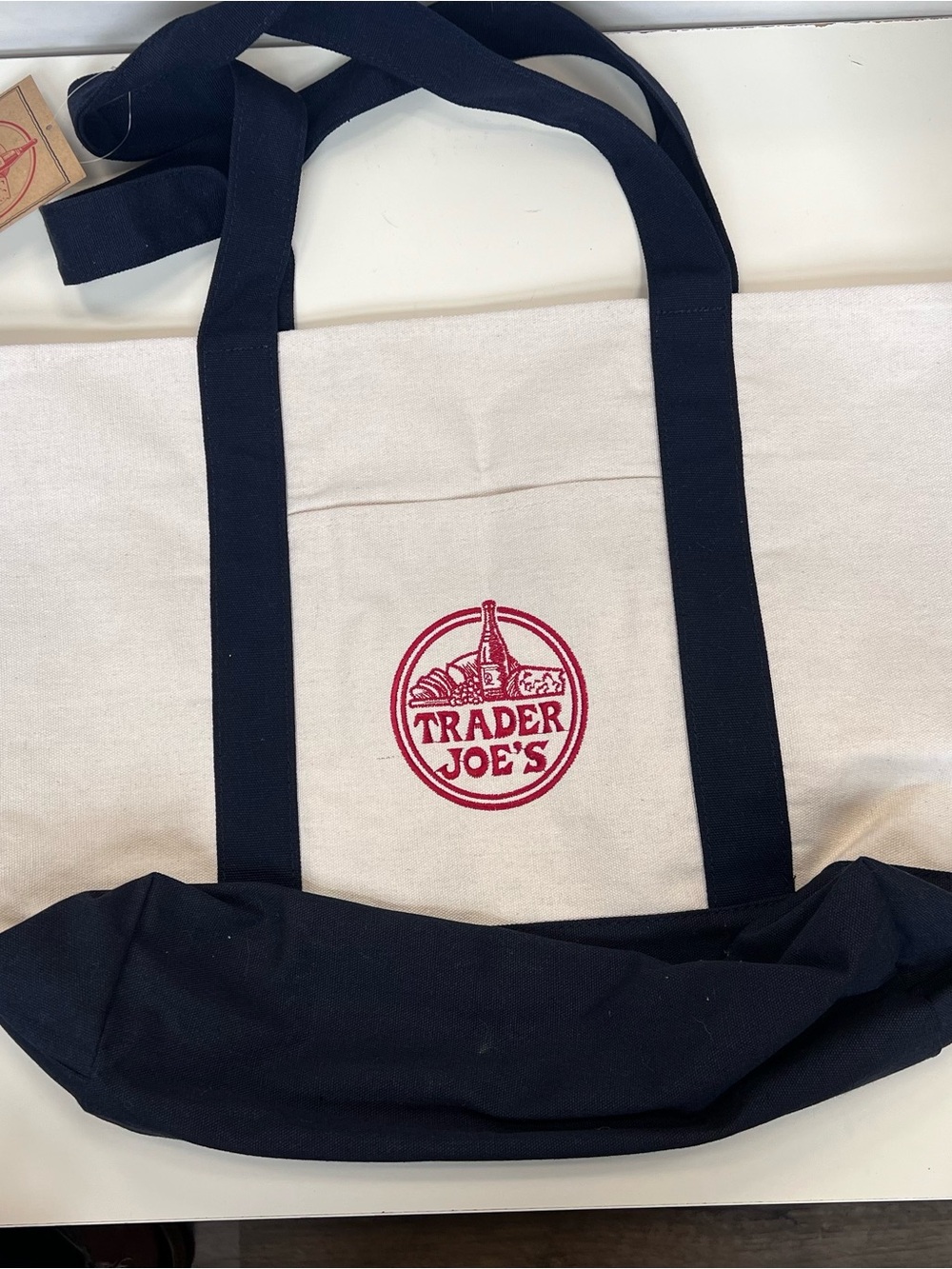 Large Trader Joe's Cream Canvas Tote with Navy Blue Handles and Red Logo